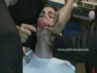 Gay Twink In White Shirt Held By Strong Men And Tied With A Mouth Bondage Gag Before Getting Sucked